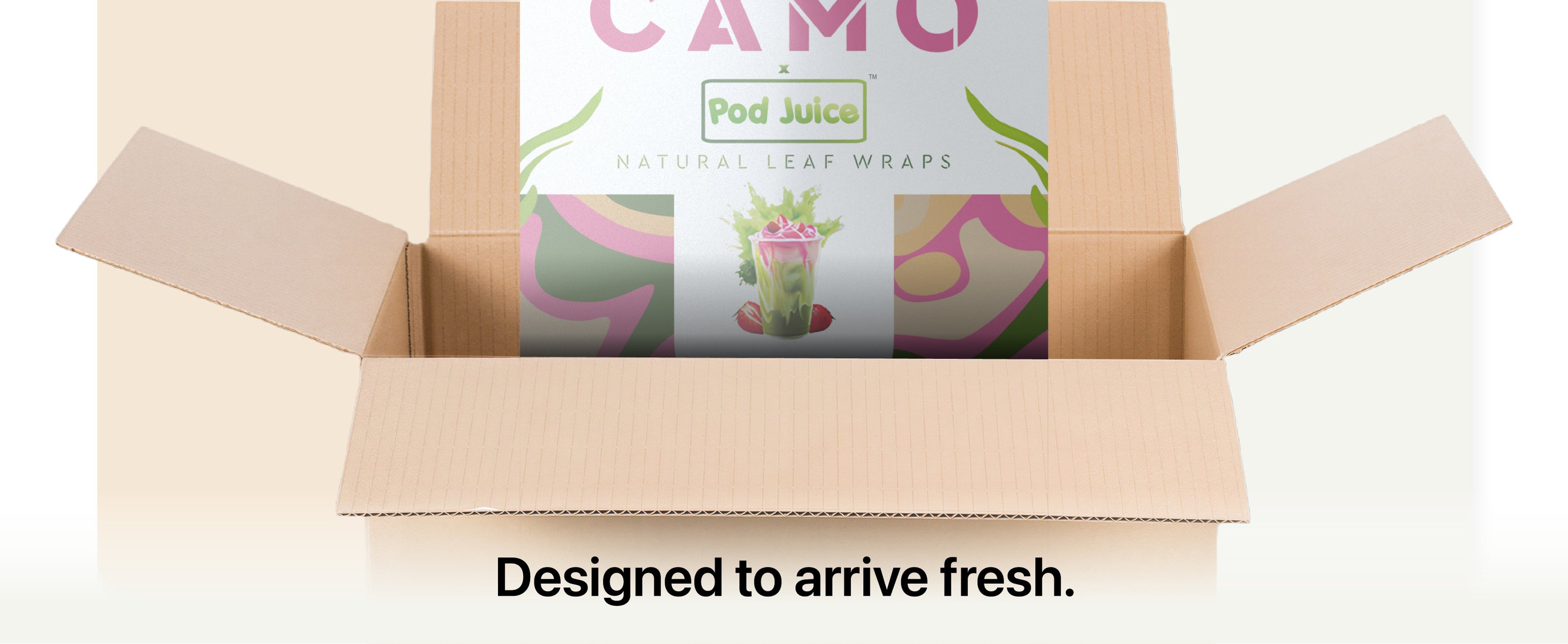 A cardboard box is open, showing a colorful package labeled CAMO x Pod Juice Natural Leaf Wraps with text below reading Designed to arrive fresh.
