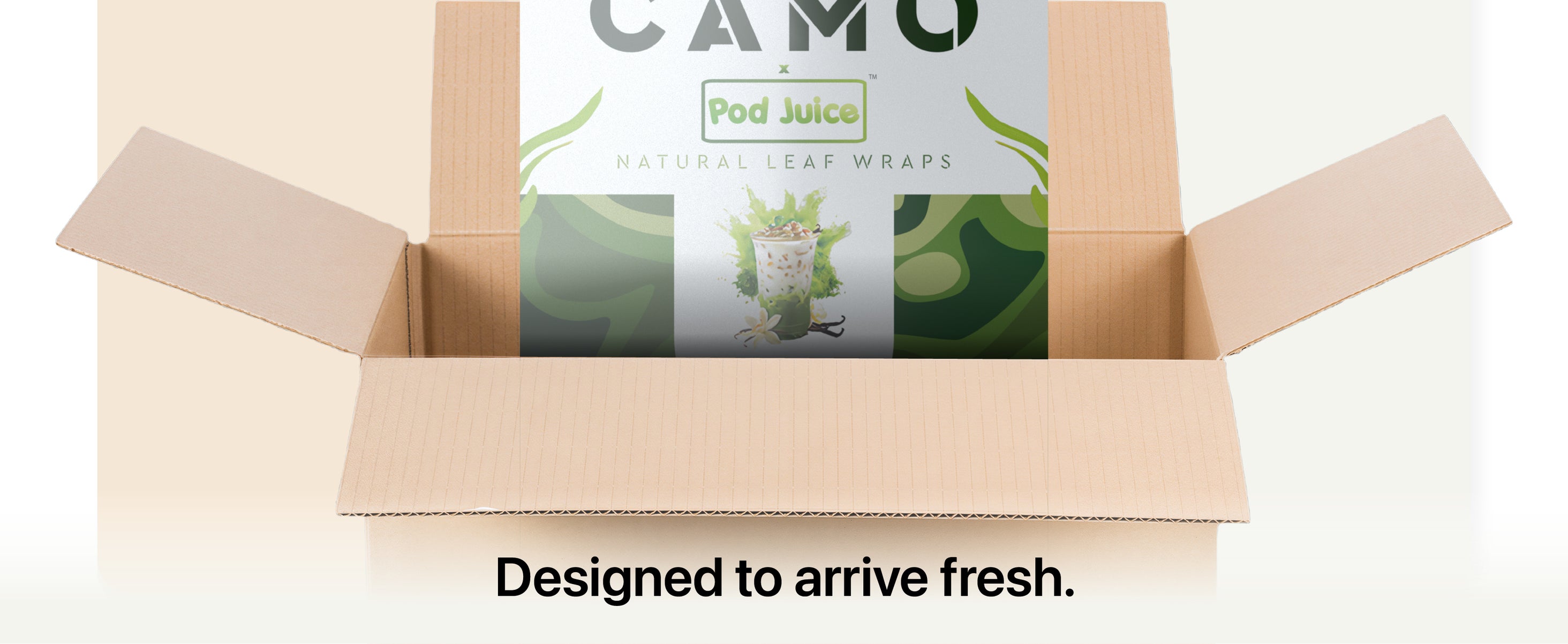 An open cardboard box containing a package of CAMO Pod Juice Natural Leaf Wraps. Text below says, “Designed to arrive fresh and flavorful.”.