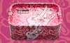 A pink rectangular Airtight Stash Box & Tray featuring abstract patterns and a large illustrated hand with an eye on its palm. The word CAMO is printed inside, and the container is placed on a matching patterned background.